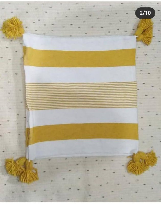 Plaid tissé à rayures jaunes et pompons